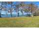 Grass yard leading to lake with boathouse at 491 Carolyn Dr, Oviedo, FL 32765