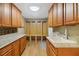 Laundry room with granite countertop and wooden cabinets at 491 Carolyn Dr, Oviedo, FL 32765