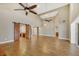 Bright living room with high ceilings, ceiling fans, and wood-look tile floors at 491 Carolyn Dr, Oviedo, FL 32765