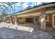 Spacious covered patio with stone columns and pavers, overlooking the pool at 491 Carolyn Dr, Oviedo, FL 32765