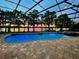 Stunning pool and patio area with lake view, perfect for outdoor entertaining at 491 Carolyn Dr, Oviedo, FL 32765