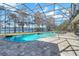 Resort-style screened pool with lake views at 491 Carolyn Dr, Oviedo, FL 32765