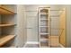 Large walk-in closet with shelves and hanging rods at 491 Carolyn Dr, Oviedo, FL 32765