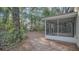 A view of the screened-in porch and backyard with mature trees at 505 Harvard Pl, Apopka, FL 32703