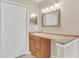 Modern bathroom vanity with a brown countertop and white sink at 505 Harvard Pl, Apopka, FL 32703