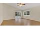 Bright bedroom with hardwood floors and sliding door to patio at 505 Harvard Pl, Apopka, FL 32703