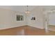 Dining area with view to kitchen includes hardwood floors, neutral paint, and lots of light at 505 Harvard Pl, Apopka, FL 32703