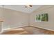 Bright living room featuring hardwood floors and a large window at 505 Harvard Pl, Apopka, FL 32703