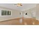 Bright living room with lots of light features hardwood floors, neutral paint, and a ceiling fan at 505 Harvard Pl, Apopka, FL 32703