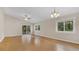 Large living area with hardwood floors, and windows at 505 Harvard Pl, Apopka, FL 32703