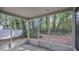 Cozy screened porch overlooking a wooded backyard at 505 Harvard Pl, Apopka, FL 32703