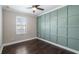 Bedroom with hardwood floors and an accent wall at 5419 Baldwin Park St, Orlando, FL 32814