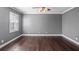 Spacious bedroom with hardwood floors and gray walls at 5419 Baldwin Park St, Orlando, FL 32814