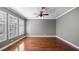 Hardwood floor bedroom with gray walls and windows at 5419 Baldwin Park St, Orlando, FL 32814