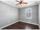 Bright bedroom featuring hardwood floors and ceiling fan at 5419 Baldwin Park St, Orlando, FL 32814