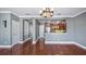 Hardwood floor dining room with kitchen passthrough at 5419 Baldwin Park St, Orlando, FL 32814