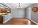 Bright dining room features hardwood floors and a chandelier at 5419 Baldwin Park St, Orlando, FL 32814