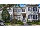 Townhouse exterior featuring classic architecture and landscaping at 5419 Baldwin Park St, Orlando, FL 32814