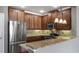 Modern kitchen with stainless steel appliances and granite counters at 5419 Baldwin Park St, Orlando, FL 32814