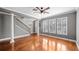 Living room with hardwood floors, columns, and a staircase at 5419 Baldwin Park St, Orlando, FL 32814