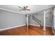 Living room with hardwood floors, a ceiling fan and columns at 5419 Baldwin Park St, Orlando, FL 32814