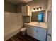 Updated bathroom with white vanity, quartz countertop, and bathtub at 5538 Pga Nw Blvd # 5025, Orlando, FL 32839