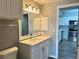 Bathroom with vanity, quartz countertop, and kitchen view at 5538 Pga Nw Blvd # 5025, Orlando, FL 32839