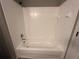 Clean bathroom with a white bathtub and shower combination, and updated tile at 5538 Pga Nw Blvd # 5025, Orlando, FL 32839