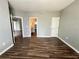 Bright bedroom with wood-look floors and access to bathroom at 5538 Pga Nw Blvd # 5025, Orlando, FL 32839