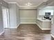 Bright dining area with wood-look flooring and access to the kitchen at 5538 Pga Nw Blvd # 5025, Orlando, FL 32839