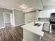 Modern kitchen with white cabinets, quartz countertops and stainless steel appliances at 5538 Pga Nw Blvd # 5025, Orlando, FL 32839