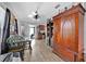 Bright dining area with wood floors and a large armoire at 590 W Vine St, Bartow, FL 33830