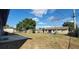 Backyard view showcasing patio and grassy area at 610 Thomas Ave, Winter Haven, FL 33880