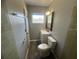 Clean bathroom with updated vanity, tile shower and floor at 610 Thomas Ave, Winter Haven, FL 33880