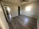 Bedroom with new wood-look flooring and a ceiling fan at 610 Thomas Ave, Winter Haven, FL 33880