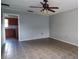 Living room with tile floors, ceiling fan, and an open concept at 610 Thomas Ave, Winter Haven, FL 33880