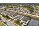 Aerial view of a neighborhood showcasing homes with pools and screened enclosures at 627 Copeland Dr, Haines City, FL 33844