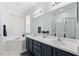 Bathroom with double vanity, large mirror, and soaking tub at 627 Copeland Dr, Haines City, FL 33844