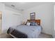 Bright bedroom with a king-size bed and double doors to closet at 627 Copeland Dr, Haines City, FL 33844