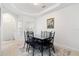 Simple dining area with dark chairs and artwork at 627 Copeland Dr, Haines City, FL 33844