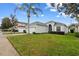 One-story house with a two-car garage and well-kept lawn at 627 Copeland Dr, Haines City, FL 33844