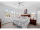 Bright main bedroom with wood furniture and large window at 627 Copeland Dr, Haines City, FL 33844