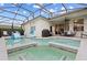 Spacious pool and spa with patio furniture and a slide at 627 Copeland Dr, Haines City, FL 33844