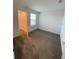 Spacious bedroom with carpet flooring and walk-in closet at 768 Staffora St, Haines City, FL 33844