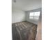 Well-lit bedroom featuring carpet flooring and a window at 768 Staffora St, Haines City, FL 33844