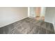 Spacious carpeted bedroom with neutral walls and a large doorway and closet at 768 Staffora St, Haines City, FL 33844