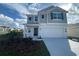Charming two-story home featuring a two-car garage, well-manicured lawn and pleasant curb appeal at 768 Staffora St, Haines City, FL 33844