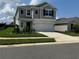 Charming two-story home featuring a two-car garage, well-manicured lawn and pleasant curb appeal at 768 Staffora St, Haines City, FL 33844