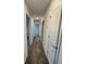 Hallway with carpet and access to bedrooms at 768 Staffora St, Haines City, FL 33844