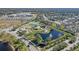 Aerial view of community amenities including park, playground, tennis courts, and pond at 820 Spring Oak Cir, Orlando, FL 32828